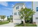 Side view of a two-story home with a garage and a large shade tree at 1436 Belmont Ave, Smyrna, GA 30080