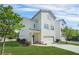 Side view of a two-story home with a garage and well-manicured lawn at 1436 Belmont Ave, Smyrna, GA 30080