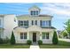 Inviting two-story home with a classic facade, complemented by lush green lawn and manicured bushes at 1436 Belmont Ave, Smyrna, GA 30080