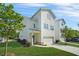 Side view of a two-story home with a garage and well-manicured lawn at 1436 Belmont Ave, Smyrna, GA 30080