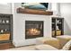 Close up of the fireplace, with wooden mantle and built in shelves at 1436 Belmont Ave, Smyrna, GA 30080