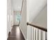 Hallway with hardwood floors, white trim, and a staircase leading to the upper level at 1436 Belmont Ave, Smyrna, GA 30080