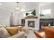 Bright living room featuring fireplace, hardwood flooring, shiplap accent wall, and lots of natural light at 1436 Belmont Ave, Smyrna, GA 30080