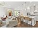 Open-concept living space with kitchen, dining area, and stylish decor, showcasing a seamless flow at 1436 Belmont Ave, Smyrna, GA 30080