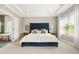 Serene main bedroom with a comfortable bed, tray ceilings, and views of an ensuite bathroom at 1436 Belmont Ave, Smyrna, GA 30080
