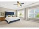 Spacious main bedroom with a large bed, plush carpet, and ample natural light from windows at 1436 Belmont Ave, Smyrna, GA 30080