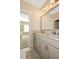 Bathroom with double vanity, granite countertop, and carpet in the next room at 200 Dawson Dr, Woodstock, GA 30188