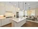 Spacious kitchen with white cabinetry, a center island, stainless appliances, and a dining area at 200 Dawson Dr, Woodstock, GA 30188