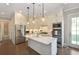 Bright and open kitchen with stainless steel appliances and a large center island at 200 Dawson Dr, Woodstock, GA 30188