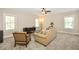 Spacious living room with plush carpet, neutral walls, and great natural light at 200 Dawson Dr, Woodstock, GA 30188