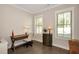 Bright home office featuring a wooden desk, neutral walls, and natural light at 200 Dawson Dr, Woodstock, GA 30188