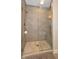 Contemporary shower with a glass door, built-in bench, and decorative flooring at 200 Dawson Dr, Woodstock, GA 30188