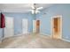 Spacious bedroom with plush carpeting, multiple windows, and multiple closets for ample storage at 3094 Lauren Parc Rd, Decatur, GA 30032