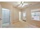 Bedroom with a ceiling fan and closet looking out to the backyard at 3094 Lauren Parc Rd, Decatur, GA 30032
