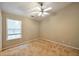 Bedroom with a ceiling fan and large window, and neutral carpet at 3094 Lauren Parc Rd, Decatur, GA 30032