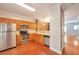 Modern kitchen featuring stainless steel appliances, wooden cabinets and hardwood floors at 3094 Lauren Parc Rd, Decatur, GA 30032