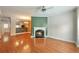 Bright living room featuring a fireplace, ceiling fan, and hardwood floors at 3094 Lauren Parc Rd, Decatur, GA 30032