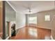Bright living room featuring a fireplace, ceiling fan, and hardwood floors at 3094 Lauren Parc Rd, Decatur, GA 30032