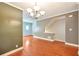 Open-concept living room featuring hardwood floors, chandelier and neutral paint at 3094 Lauren Parc Rd, Decatur, GA 30032