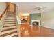 Cozy living room with hardwood floors, fireplace, staircase, and an open floor plan at 3094 Lauren Parc Rd, Decatur, GA 30032