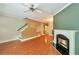 Bright living room featuring a fireplace, ceiling fan, and hardwood floors at 3094 Lauren Parc Rd, Decatur, GA 30032