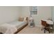 Cozy bedroom with a twin bed, desk, and large window at 358 W West Wind Sw Dr, Lilburn, GA 30047