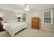 A relaxing bedroom showcases neutral walls, carpet, and a ceiling fan at 358 W West Wind Sw Dr, Lilburn, GA 30047
