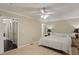 A relaxing bedroom showcases neutral walls, carpet, and a ceiling fan at 358 W West Wind Sw Dr, Lilburn, GA 30047