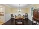 Traditional dining room with hardwood floors, elegant chandelier, and vintage furniture at 358 W West Wind Sw Dr, Lilburn, GA 30047