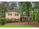 Charming two-story home with a brick and siding exterior and well-maintained landscaping at 358 W West Wind Sw Dr, Lilburn, GA 30047
