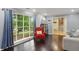 Bright living room with hardwood floors, a large window, and access to other rooms at 358 W West Wind Sw Dr, Lilburn, GA 30047