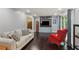 Inviting living room with hardwood floors, comfortable seating, and a custom built-in entertainment center at 358 W West Wind Sw Dr, Lilburn, GA 30047