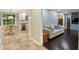 Open-concept home featuring a view of the kitchen with an adjacent living room that has hardwood floors at 358 W West Wind Sw Dr, Lilburn, GA 30047