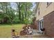 Brick patio includes chairs and a grill overlooking the yard, and a brick home exterior at 358 W West Wind Sw Dr, Lilburn, GA 30047