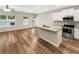 Bright, open-concept kitchen featuring an island and stainless steel appliances at 6001 Oak Bend Ct, Riverdale, GA 30296