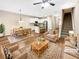 Inviting living area featuring hardwood floors, ceiling fan, dining area, and a modern kitchen at 6001 Oak Bend Ct, Riverdale, GA 30296