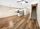 Spacious living room with hardwood floors open to the kitchen and stairway at 6001 Oak Bend Ct, Riverdale, GA 30296