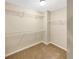 Spacious walk-in closet with built-in shelving for organization and storage at 6001 Oak Bend Ct, Riverdale, GA 30296