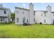 Green grass backyard featuring a small patio with an outdoor seating area at 6606 Coventry Pt, Austell, GA 30168