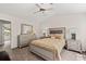 Bedroom with carpet and vaulted ceiling featuring a bed and two chests of drawers and side tables at 6606 Coventry Pt, Austell, GA 30168