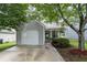 Charming two-story home with a well-manicured front yard and a one-car garage at 6606 Coventry Pt, Austell, GA 30168