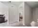 Hallway in the house leading to rooms with carpeted floor and white walls at 6606 Coventry Pt, Austell, GA 30168