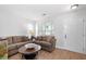 Comfortable living room with a large window, providing ample natural light and an inviting atmosphere at 6606 Coventry Pt, Austell, GA 30168