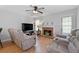 Inviting living room with a brick fireplace and comfortable seating at 6606 Coventry Pt, Austell, GA 30168