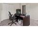Carpeted office with a computer and storage, featuring a closet and natural light at 6606 Coventry Pt, Austell, GA 30168