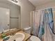 Clean bathroom showcasing a bathtub and a vanity sink with a large mirror and warm lighting at 2090 Marbut Ln, Lithonia, GA 30058
