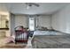 Bright bedroom showcasing neutral decor, featuring a crib and a comfortable full-sized bed at 2090 Marbut Ln, Lithonia, GA 30058
