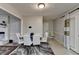 The dining room has white chairs and table, fireplace, and overhead lighting at 2090 Marbut Ln, Lithonia, GA 30058