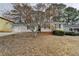 Charming single-story home with a well-kept lawn, features a convenient one-car garage at 2090 Marbut Ln, Lithonia, GA 30058