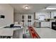 This kitchen has white cabinets, stainless steel appliances, and an adjacent dining area at 2090 Marbut Ln, Lithonia, GA 30058